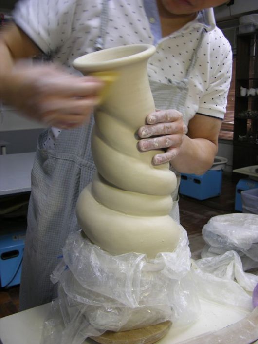Tsang Sculpts a Dragon Strangling A Porcelain Vase