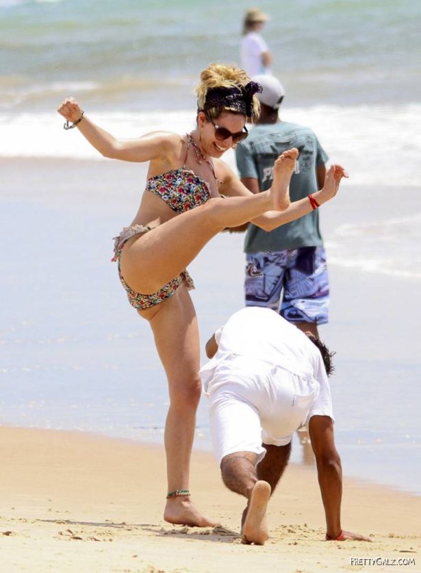 Kelly Brook Having Fun At Beach