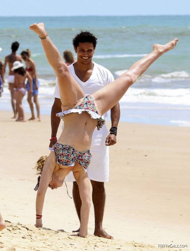Kelly Brook Having Fun At Beach