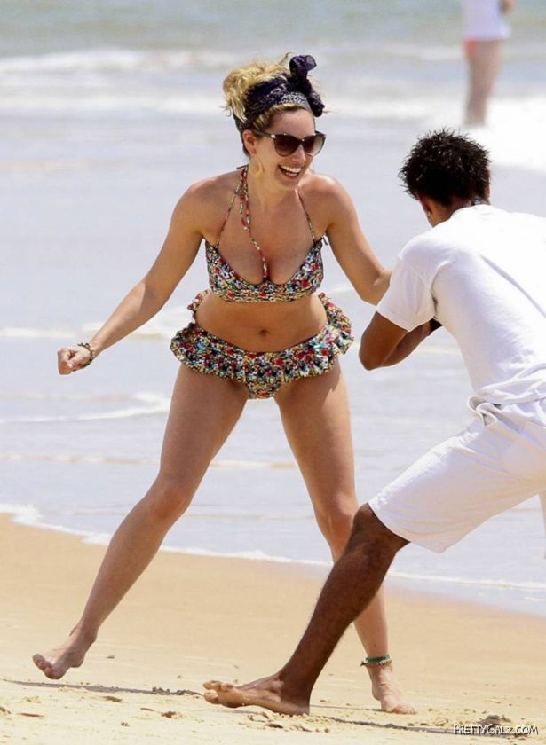Kelly Brook Having Fun At Beach