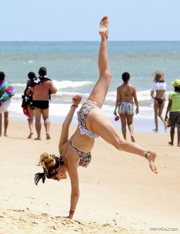 Kelly Brook Having Fun At Beach