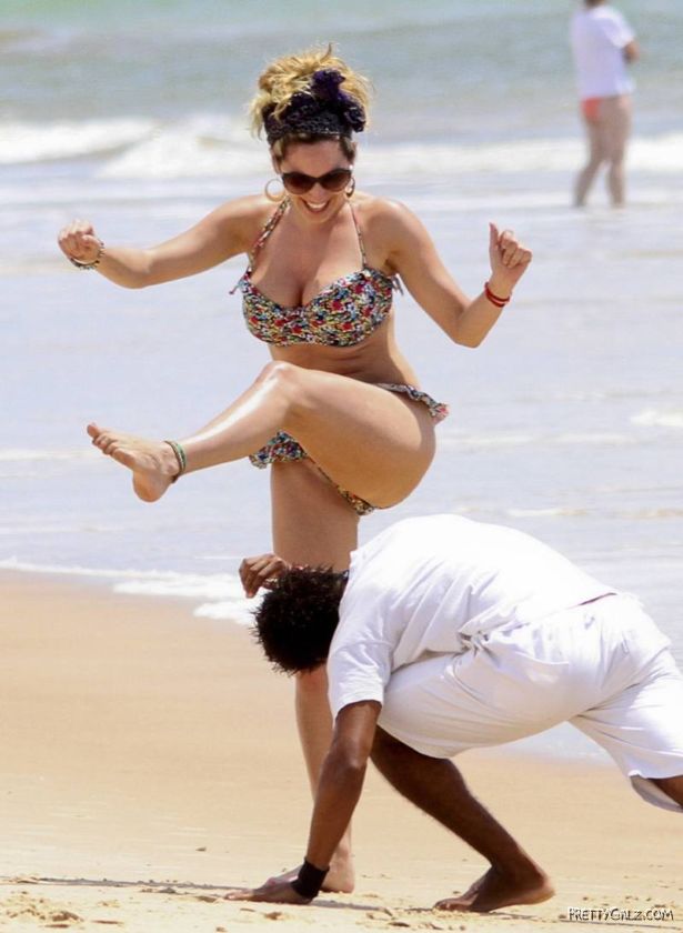 Kelly Brook Having Fun At Beach